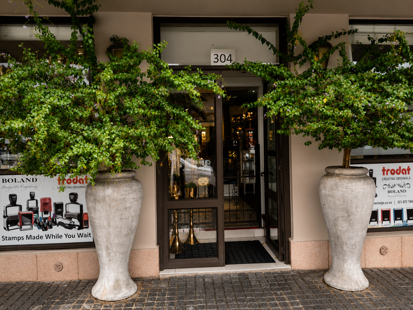 Boland Badge Store Entrance with Plants